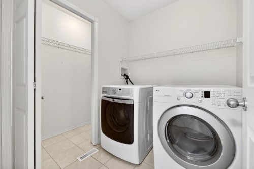 240 Cove Drive, Chestermere, AB - Indoor Photo Showing Laundry Room