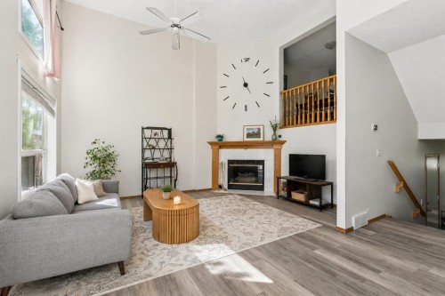 222 Anderson Grove Sw, Calgary, AB - Indoor Photo Showing Living Room With Fireplace