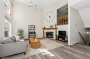 222 Anderson Grove Sw, Calgary, AB  - Indoor Photo Showing Living Room With Fireplace 
