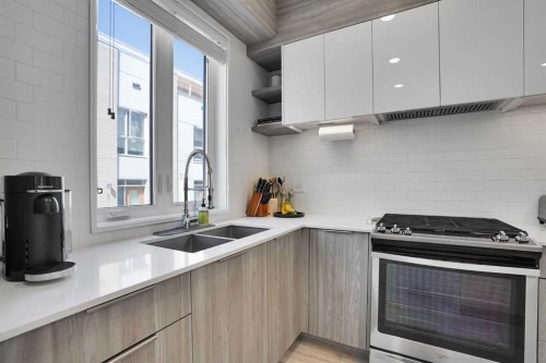 4012 Kovitz Lane Nw, Calgary, AB - Indoor Photo Showing Kitchen With Double Sink With Upgraded Kitchen