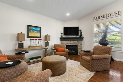 2193 High Country Rise Nw, High River, AB - Indoor Photo Showing Living Room With Fireplace