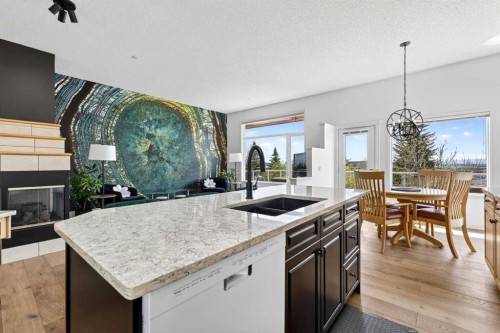 18 Eagleview Place, Cochrane, AB - Indoor Photo Showing Kitchen With Double Sink