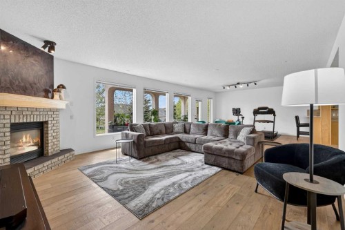 18 Eagleview Place, Cochrane, AB - Indoor Photo Showing Living Room With Fireplace