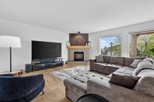 18 Eagleview Place, Cochrane, AB - Indoor Photo Showing Living Room With Fireplace