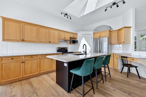 18 Eagleview Place, Cochrane, AB - Indoor Photo Showing Kitchen With Upgraded Kitchen
