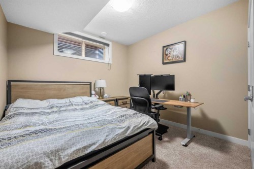 63 Cortina Villas Sw, Calgary, AB - Indoor Photo Showing Bedroom