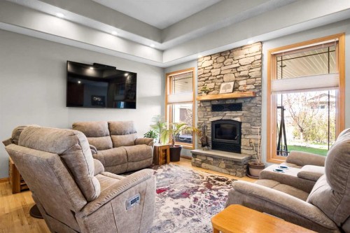 2 Harrison Green, Olds, AB - Indoor Photo Showing Living Room With Fireplace