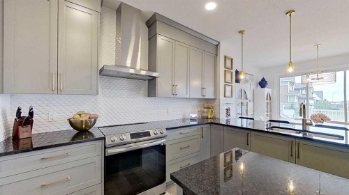 168 Magnolia Manor Se, Calgary, AB - Indoor Photo Showing Kitchen With Upgraded Kitchen