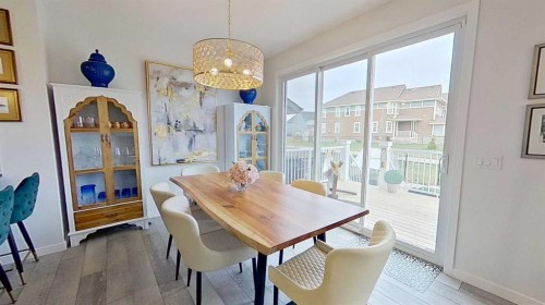 168 Magnolia Manor Se, Calgary, AB - Indoor Photo Showing Dining Room