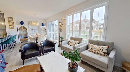 168 Magnolia Manor Se, Calgary, AB - Indoor Photo Showing Living Room