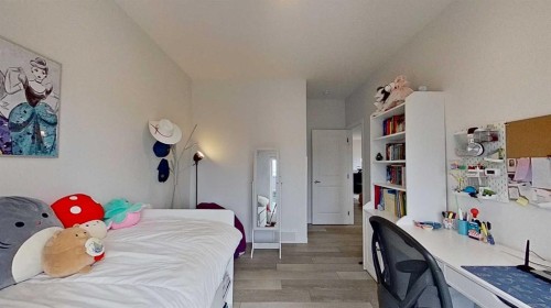 168 Magnolia Manor Se, Calgary, AB - Indoor Photo Showing Bedroom