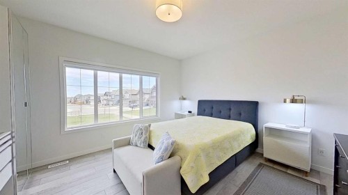168 Magnolia Manor Se, Calgary, AB - Indoor Photo Showing Bedroom