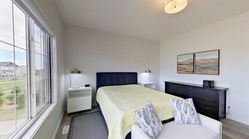 168 Magnolia Manor Se, Calgary, AB - Indoor Photo Showing Bedroom