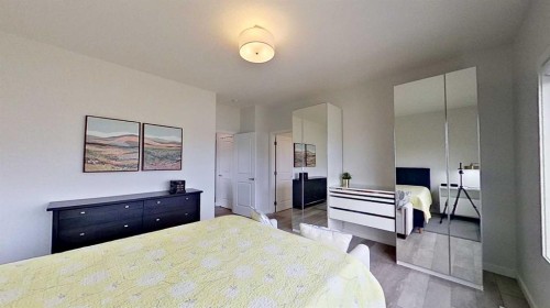 168 Magnolia Manor Se, Calgary, AB - Indoor Photo Showing Bedroom