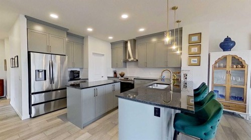 168 Magnolia Manor Se, Calgary, AB - Indoor Photo Showing Kitchen With Upgraded Kitchen