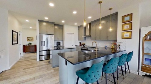 168 Magnolia Manor Se, Calgary, AB - Indoor Photo Showing Kitchen With Double Sink With Upgraded Kitchen