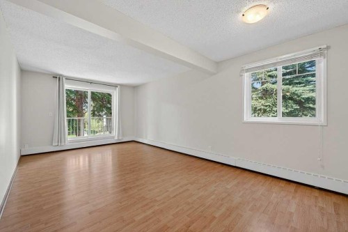 202A-5601 Dalton Drive Nw, Calgary, AB - Indoor Photo Showing Other Room