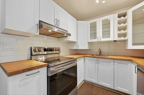 202A-5601 Dalton Drive Nw, Calgary, AB - Indoor Photo Showing Kitchen