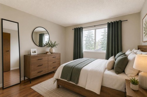 864 Queensland Drive Se, Calgary, AB - Indoor Photo Showing Bedroom