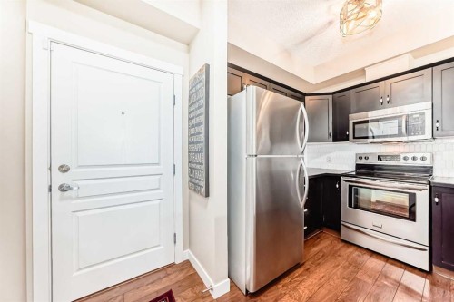 2105-211 Aspen Stone Boulevard Sw, Calgary, AB - Indoor Photo Showing Kitchen With Stainless Steel Kitchen