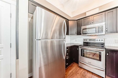 2105-211 Aspen Stone Boulevard Sw, Calgary, AB - Indoor Photo Showing Kitchen With Stainless Steel Kitchen