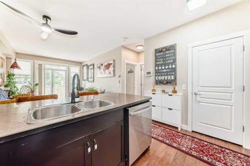 2105-211 Aspen Stone Boulevard Sw, Calgary, AB - Indoor Photo Showing Kitchen With Double Sink