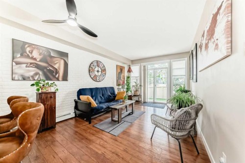 2105-211 Aspen Stone Boulevard Sw, Calgary, AB - Indoor Photo Showing Living Room
