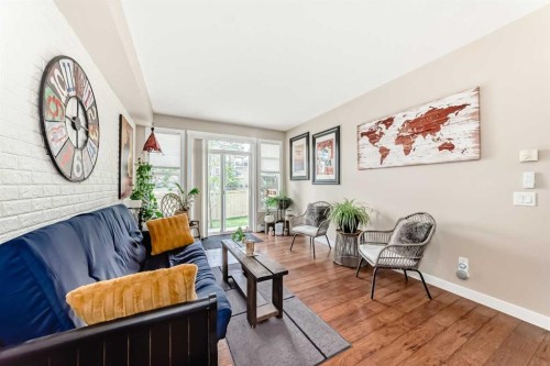 2105-211 Aspen Stone Boulevard Sw, Calgary, AB - Indoor Photo Showing Living Room