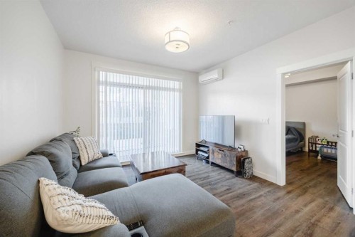105-110 Auburn Meadows View Se, Calgary, AB - Indoor Photo Showing Living Room