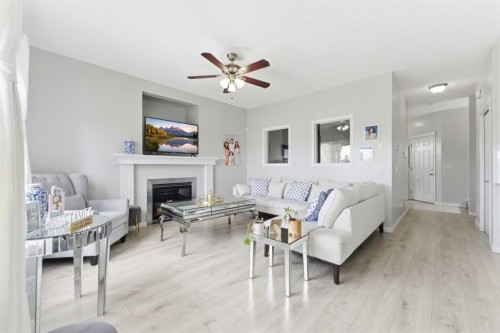118 Saddletree Close Ne, Calgary, AB - Indoor Photo Showing Living Room With Fireplace