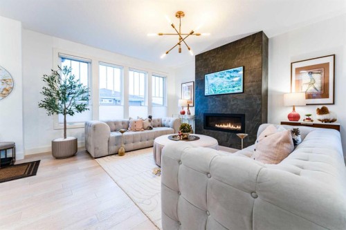 17 Cattail Run, Rural Rocky View County, AB - Indoor Photo Showing Living Room With Fireplace