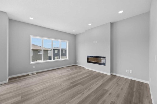 74 Lucas Place Nw, Calgary, AB - Indoor Photo Showing Living Room With Fireplace