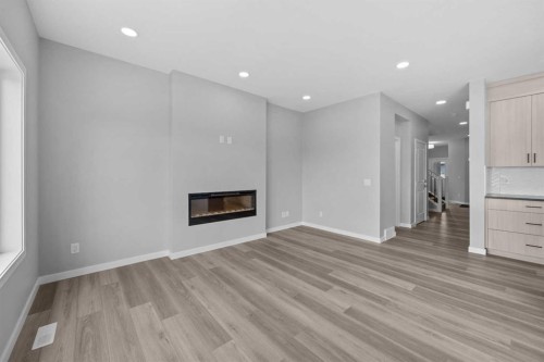 74 Lucas Place Nw, Calgary, AB - Indoor Photo Showing Living Room With Fireplace