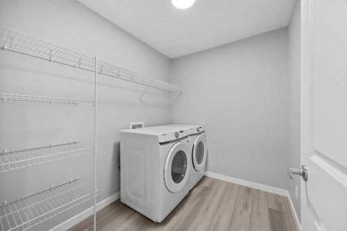74 Lucas Place Nw, Calgary, AB - Indoor Photo Showing Laundry Room