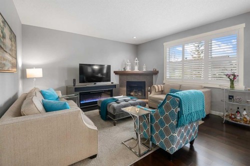 124 Evergreen Circle Sw, Calgary, AB - Indoor Photo Showing Living Room With Fireplace