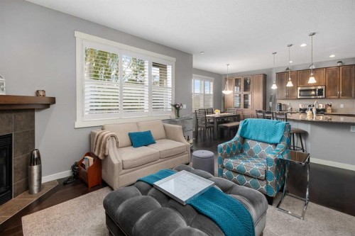 124 Evergreen Circle Sw, Calgary, AB - Indoor Photo Showing Living Room With Fireplace