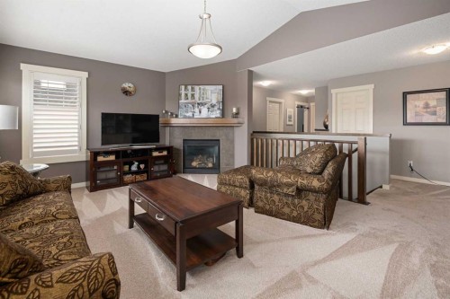 124 Evergreen Circle Sw, Calgary, AB - Indoor Photo Showing Living Room With Fireplace