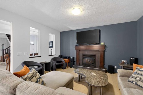 9 Westridge Way, Okotoks, AB - Indoor Photo Showing Living Room With Fireplace