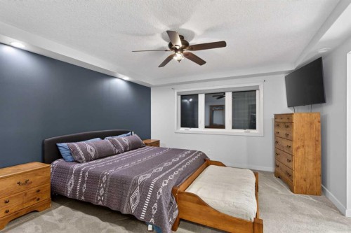 9 Westridge Way, Okotoks, AB - Indoor Photo Showing Bedroom