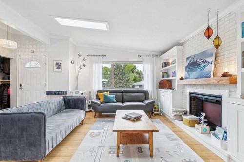 10651 Shillington Crescent Sw, Calgary, AB - Indoor Photo Showing Living Room With Fireplace