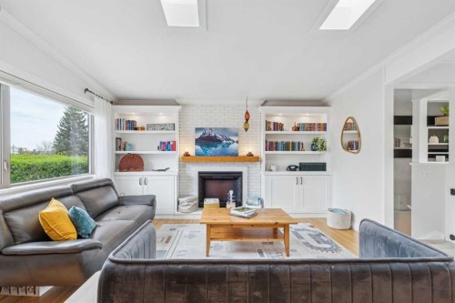 10651 Shillington Crescent Sw, Calgary, AB - Indoor Photo Showing Living Room With Fireplace