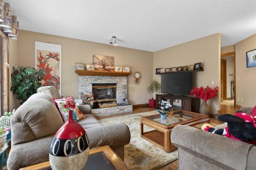935 Shawnee Drive Sw, Calgary, AB - Indoor Photo Showing Living Room With Fireplace