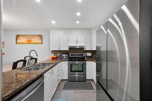 35 Erin Green Place Se, Calgary, AB - Indoor Photo Showing Kitchen With Double Sink With Upgraded Kitchen