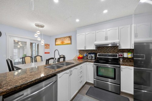 35 Erin Green Place Se, Calgary, AB - Indoor Photo Showing Kitchen With Double Sink