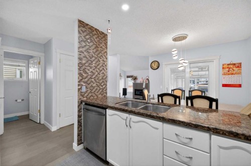 35 Erin Green Place Se, Calgary, AB - Indoor Photo Showing Kitchen With Double Sink