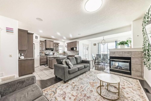 58 Bridleridge Green Sw, Calgary, AB - Indoor Photo Showing Living Room With Fireplace