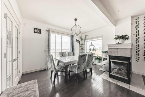 58 Bridleridge Green Sw, Calgary, AB - Indoor Photo Showing Other Room With Fireplace