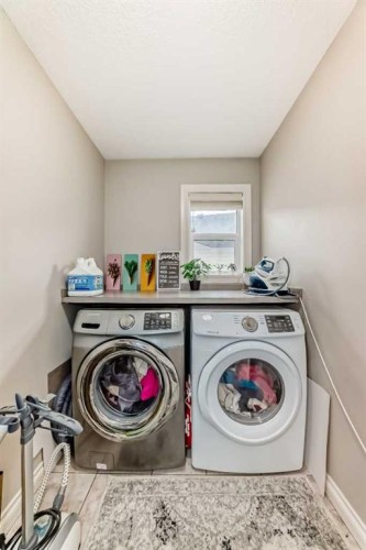 58 Bridleridge Green Sw, Calgary, AB - Indoor Photo Showing Laundry Room