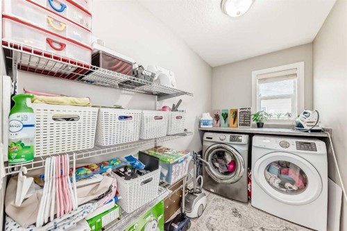 58 Bridleridge Green Sw, Calgary, AB - Indoor Photo Showing Laundry Room