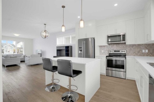 59 D'Arcy Boulevard, Okotoks, AB - Indoor Photo Showing Kitchen With Stainless Steel Kitchen With Upgraded Kitchen